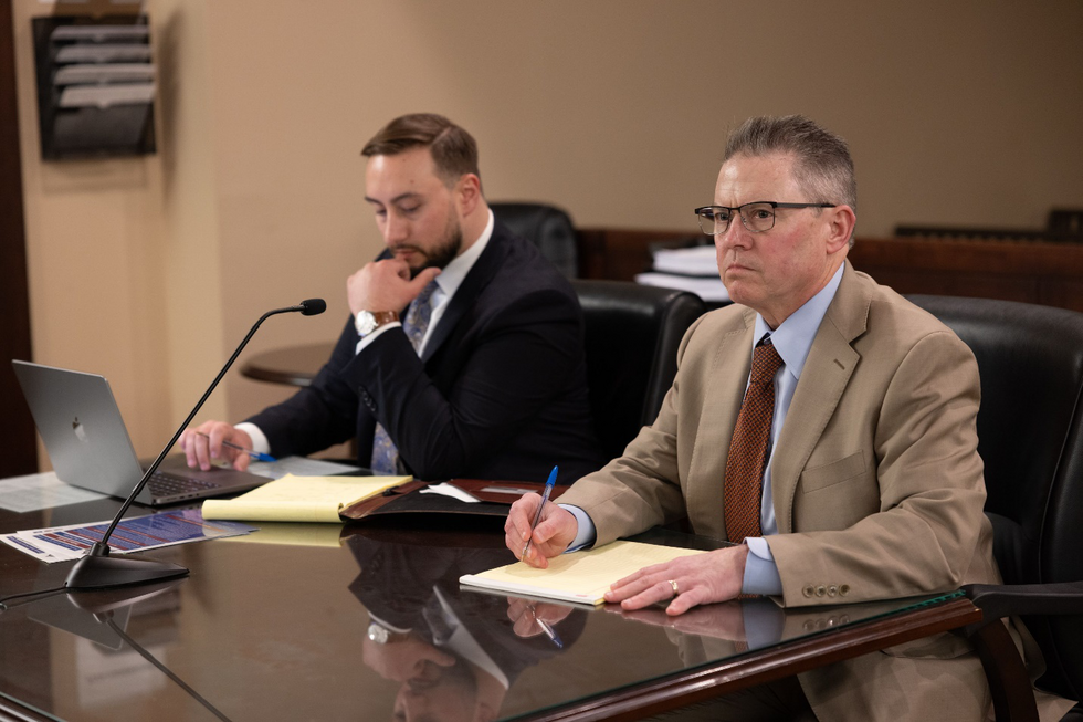 Two criminal defense lawyers in an office