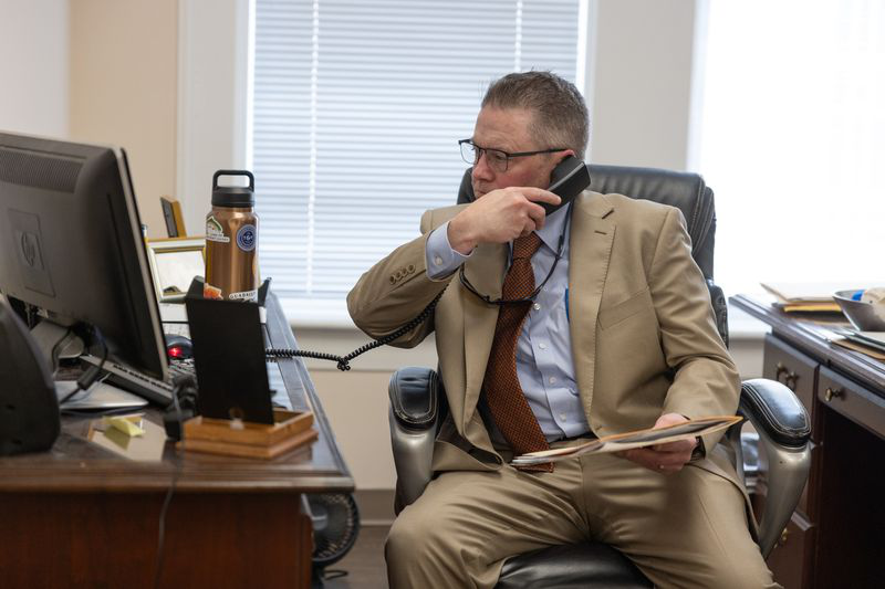 A criminal defense lawyer in his office
