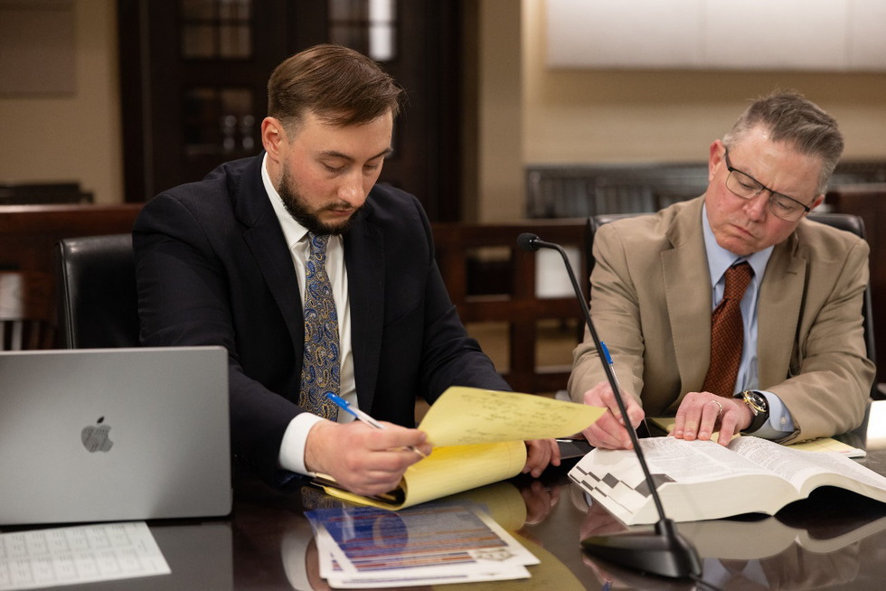 Two lawyers looking at documents together