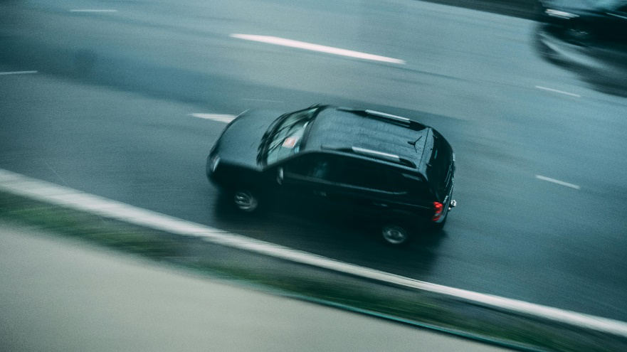 A car passing by in full speed.