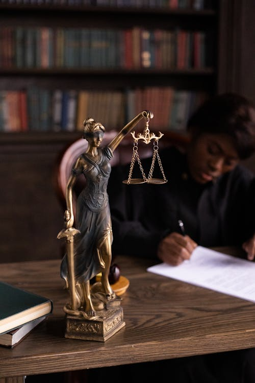 Close-up of a justice figurine with scales