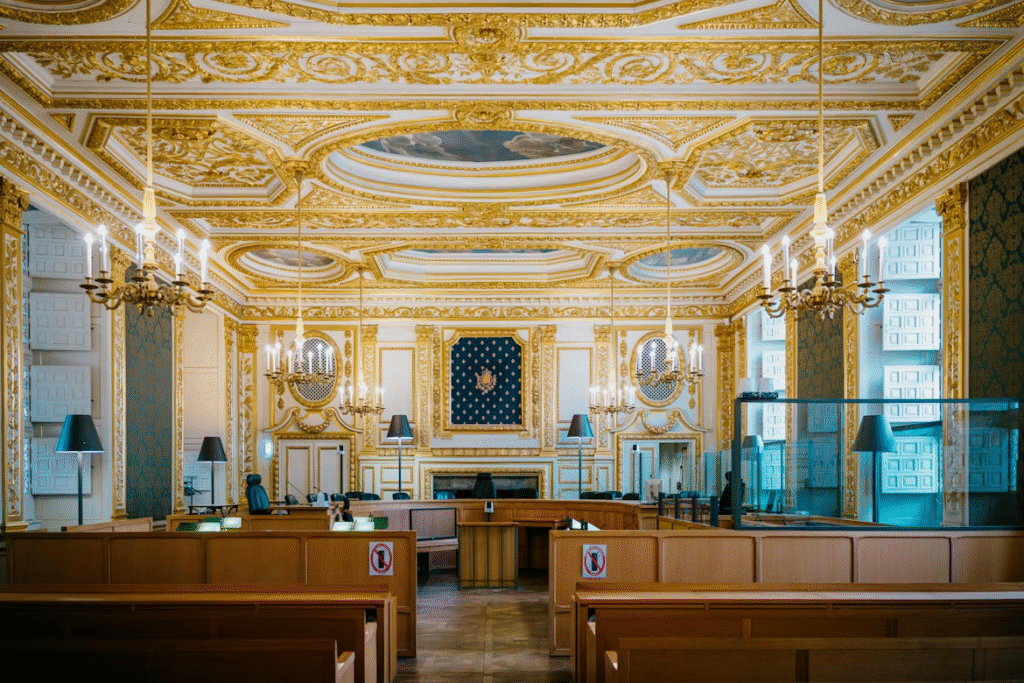 Decorative courtroom with chandeliers and detailed architecture