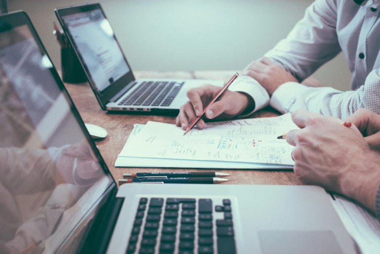 person-writing-near-laptop.jpg - Law Office of Robert M. Maurer II & Associates - Law Office of Robert M. Maurer II & Associates Person holding a pencil and writing near a laptop