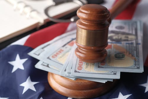 Closeup of bank notes and gavel