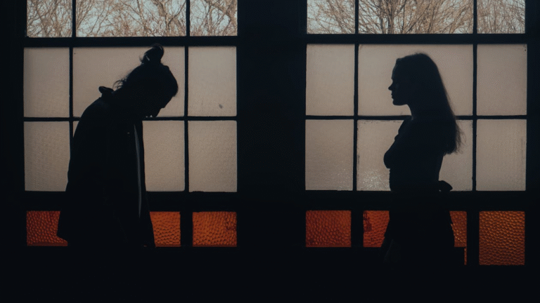 domestic-violence-people - Law Office of Robert M. Maurer II & Associates - Law Office of Robert M. Maurer II & Associates A couple standing at a distance from one another in a dark room